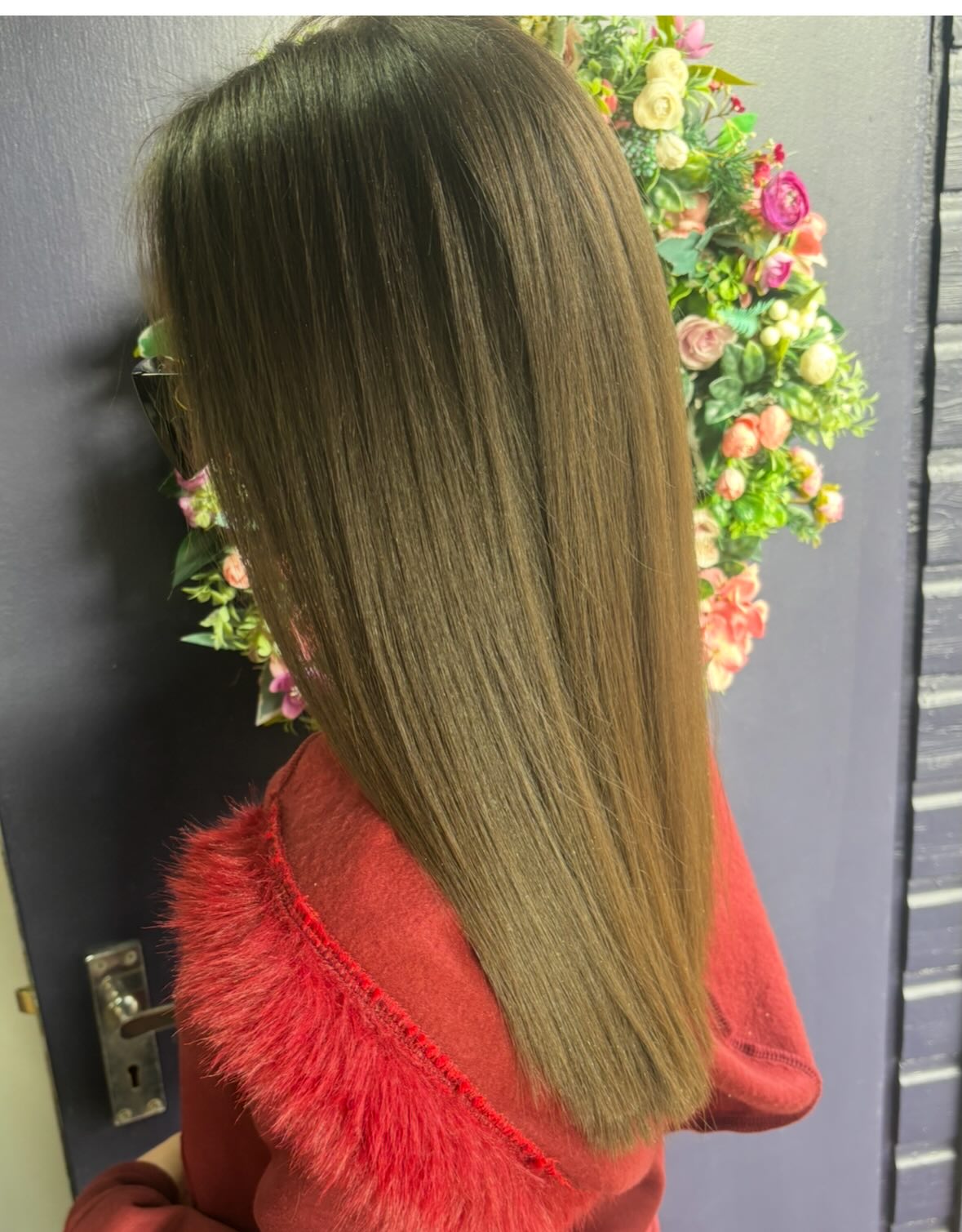 Sleek long brunette hair with a smooth glossy finish and soft face-framing layers